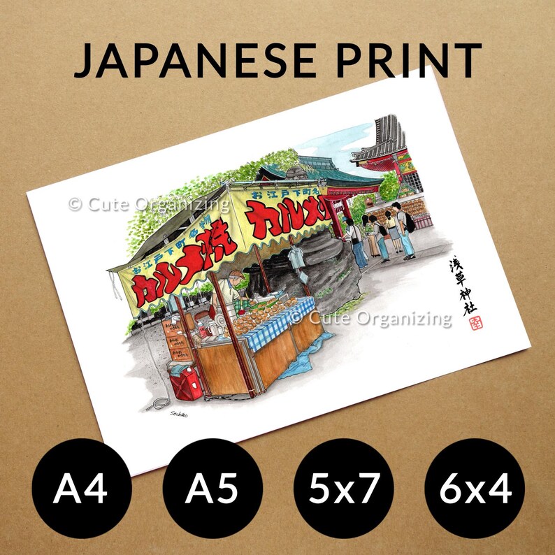 May include: A print labeled "JAPANESE PRINT" featuring a colorful illustration of a Japanese street food stall with red and yellow signage. The print includes the text "Cute Organizing" and is available in A4, A5, 5x7, and 6x4 sizes.