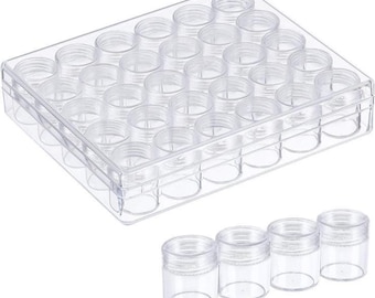 May include: A clear plastic storage container with 30 small, empty jars. Four additional jars are placed below the container. The jars have screw-on lids and are designed for storing small items like beads or glitter.