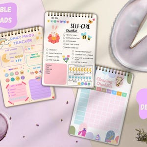 May include: Three spiral-bound notepads with colorful designs. One notepad is a daily mood tracker, another is a self-care checklist, and the third is a cleaning checklist. The words "PRINTABLE NOTEPADS" and "3 DESIGNS" are also visible.