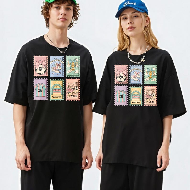 May include: Black t-shirts featuring a colorful stamp design with soccer-themed graphics. The stamps include images of soccer balls, shoes, trophies, jerseys with the number 26, and soccer goals. The text "WORLD CUP 2026" is also visible.