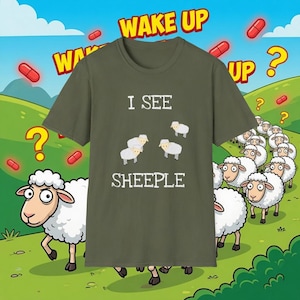 May include: Olive green t-shirt with the text "I SEE SHEEPLE" and cartoon sheep. The background features a cartoon landscape with question marks, red pills, and the words "WAKE UP".