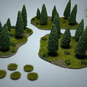 May include: Miniature terrain pieces for tabletop gaming. The set includes several island-like bases with green, textured surfaces, each populated with small, detailed evergreen trees. Additional small, round grassy patches are also included.