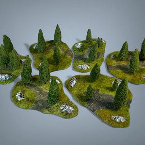 May include: Miniature terrain pieces with green grass, small trees, and rocky accents. These detailed landscape models are designed for tabletop gaming or model train layouts. The pieces are arranged on a grey background.