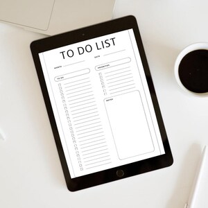 May include: A black tablet showing a digital to-do list template. The template has sections for month, date, to-do items, priorities, and notes. A cup of coffee and a pen are also visible.
