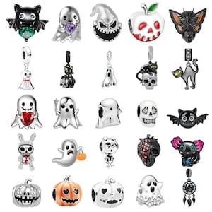 May include: A selection of silver Halloween-themed charms. Designs include bats, ghosts, skulls, pumpkins, and a butterfly. Some charms feature colourful accents like red, green, and purple. These charms are likely for bracelets or necklaces.