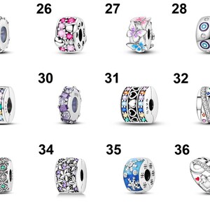 May include: A collection of silver-colored charm beads with various designs. Some beads feature colorful gemstones, while others showcase patterns like hearts, flowers, and snowflakes. One bead has an infinity heart design. These beads are likely for bracelets or necklaces.