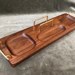 May include: A rustic wooden sign with the text "Welcome to our home" in white lettering. The sign features a distressed finish and a simple, inviting design, perfect for a front porch or entryway.