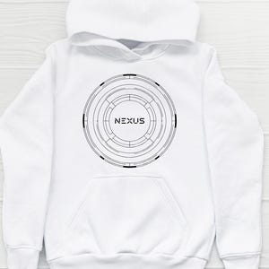 May include: White hooded sweatshirt with a black circular graphic design. The design features concentric circles and the word "NEXUS" in the center. The sweatshirt has a kangaroo pocket and a drawstring hood.
