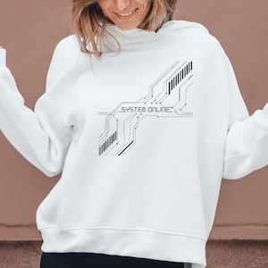 May include: White hoodie with a black graphic design featuring circuit board lines and the text "SYSTEM ONLINE." The hoodie is a casual garment, suitable for everyday wear.