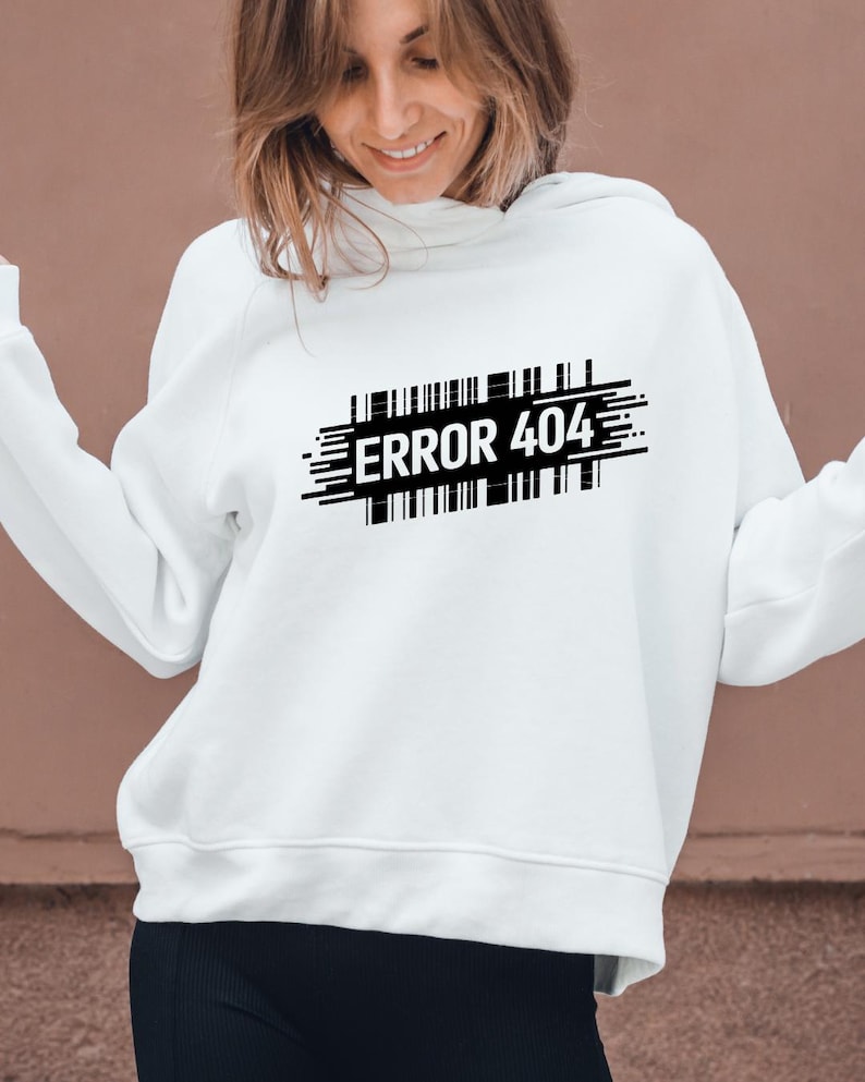 May include: White hoodie with the text "ERROR 404" in black, designed with a barcode-like graphic. The hoodie is a casual style, suitable for everyday wear.