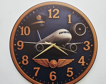 Reloj de pared de avión: decoración de aviación con manecillas doradas, gorra de piloto y arte mural de avión: regalo para pilotos, tripulantes y entusiastas de la aviación.