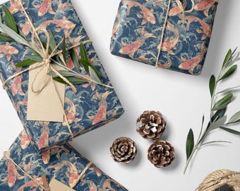May include: Gift-wrapped presents with a navy blue koi fish pattern, tied with twine and adorned with pinecones and olive branches. The gifts are rectangular and ready for giving.