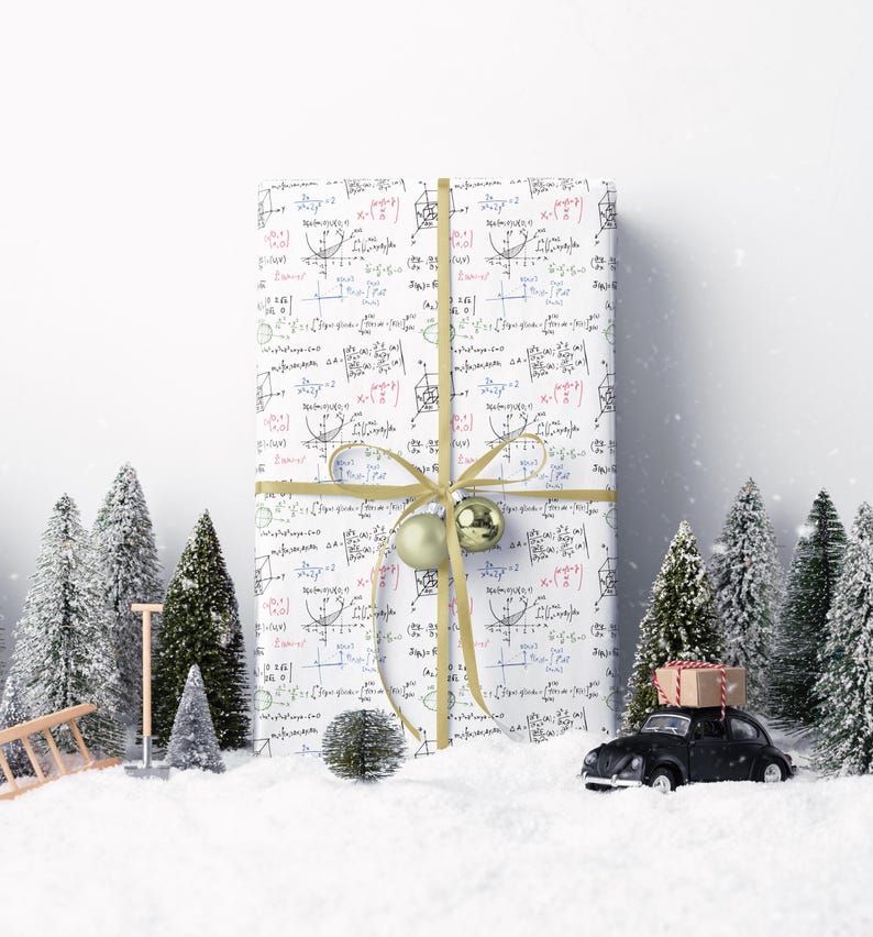 May include: A wrapped gift with a white background covered in mathematical equations, tied with a gold ribbon and bow. Two gold ornaments are attached to the bow. The gift is surrounded by miniature Christmas trees, snow, and a toy car.