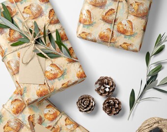 Könnte beinhalten: Geschenkverpackungen mit Brot-Motivpapier, mit Bindfaden gebunden und mit Olivenzweigen und Tannenzapfen verziert. Ein rustikales Thema mit Schere und einer Schnurrolle. Ideal für Bäckerei- oder Lebensmittelgeschenke.