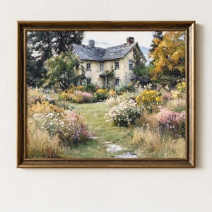 May include: A framed landscape painting depicting a two-story stone house with a gray roof, surrounded by lush green trees and a vibrant garden filled with yellow, white, and pink wildflowers, with a stone path leading toward the entrance.
