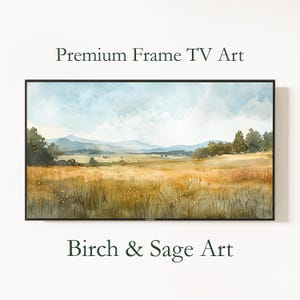 May include: A framed landscape painting with a black border. The artwork depicts a field of golden grass, trees, and mountains under a cloudy blue sky. The text "Premium Frame TV Art" and "Birch & Sage Art" are displayed.