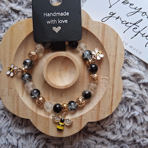 Gold and black Bee charm beaded bracelet