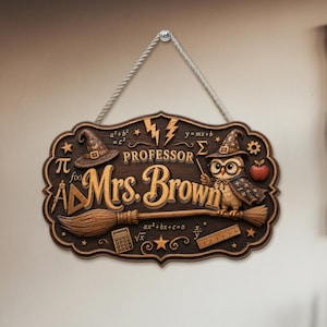 May include: A rectangular wooden wall sign with decorative edges, featuring the text "Professor Mrs. Brown" in gold lettering. The design includes an owl wearing a wizard hat, a broomstick, math symbols, a calculator, and a ruler.