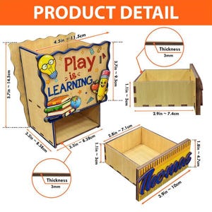 May include: Wooden desk organiser with the text "Play is Learning" and a drawer with the name "Thomas". The organiser features a light bulb, pencil, apple, books, and globe. Dimensions are 11.5cm x 14.5cm x 8.38cm.