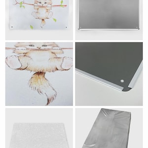 May include: White metal tin sign with rounded corners and mounting holes. The sign is blank, with the words "Design Area" printed on it. The image also shows a detail display of a cat illustration.