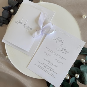 White Wedding Invitation with Embossed Date and Ribbon | Elegant Minimalist Modern Card Set for 2025 Weddings