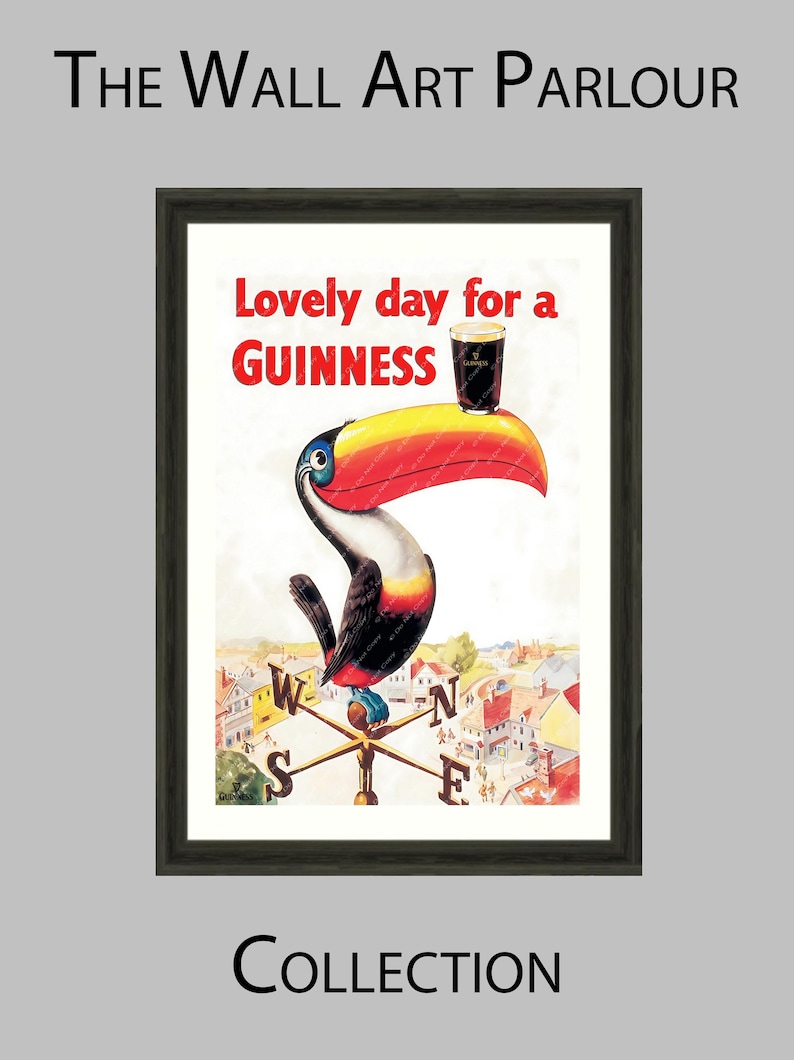 Puede incluir: Impresi&oacute;n art&iacute;stica enmarcada que presenta un tuc&aacute;n con un pico grande y colorido, sosteniendo una pinta de Guinness. La obra de arte incluye el texto "Lovely day for a Guinness" y un dise&ntilde;o de veleta. El marco es oscuro.