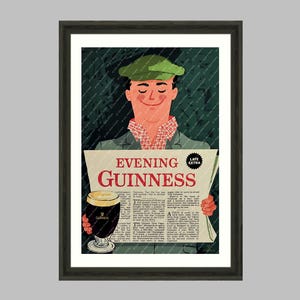 May include: Framed vintage advertisement print for Guinness stout. The artwork features a smiling person in a green cap holding a newspaper with the headline "Evening Guinness" and a pint of the dark stout. The print is part of a collection.