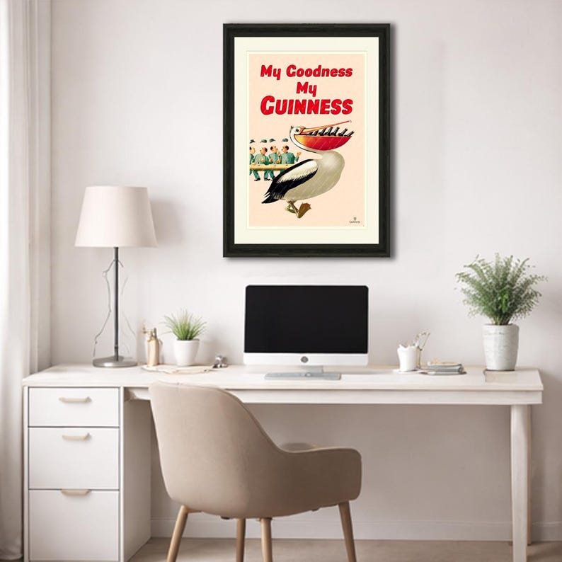 May include: Framed vintage Guinness advertisement featuring a pelican with a red beak and a black and white body. The poster has the text "My Goodness My Guinness" in red and black. The image is in a black frame.