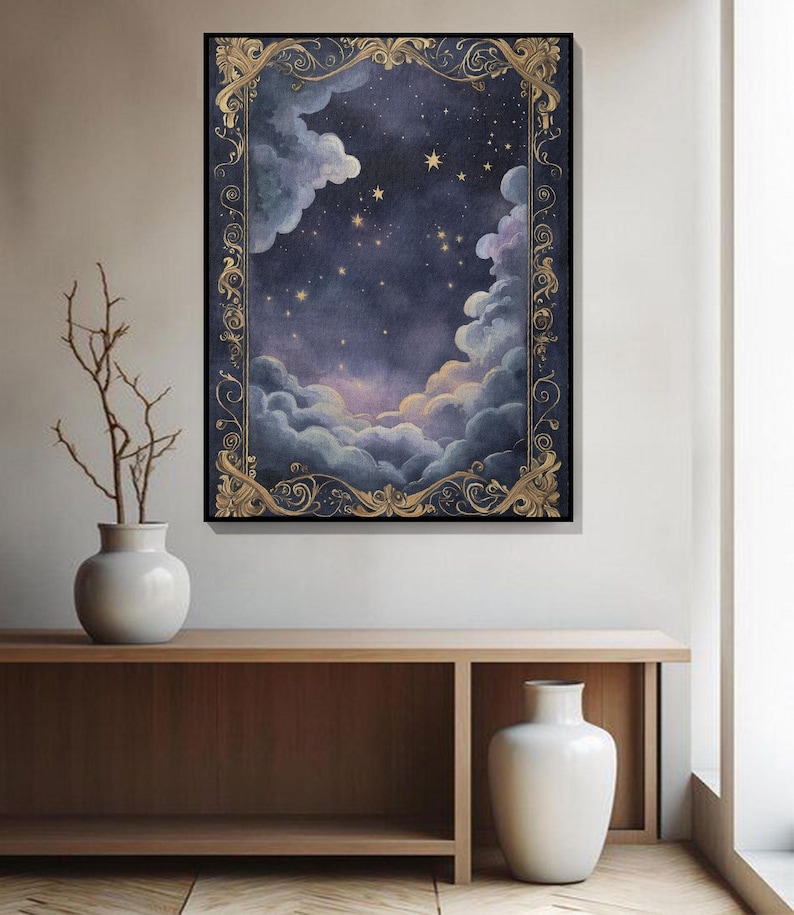 May include: A framed artwork depicting a night sky scene with clouds, stars, and a decorative gold border. The painting features a dark blue and purple color palette, creating a dreamy and celestial atmosphere. The artwork is displayed on a wall above a wooden console.