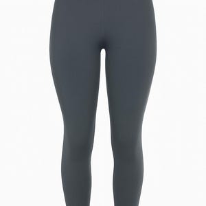 May include: Charcoal gray leggings. These full-length leggings have a high waistband and a form-fitting design. The leggings are made of a smooth, opaque fabric, suitable for various activities.