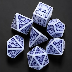 May include: Set of seven polyhedral dice in white with blue markings. The dice include a D4, D6, D8, D10, D12, D20, and a percentile die. Each die features intricate designs and numbers, perfect for tabletop gaming.