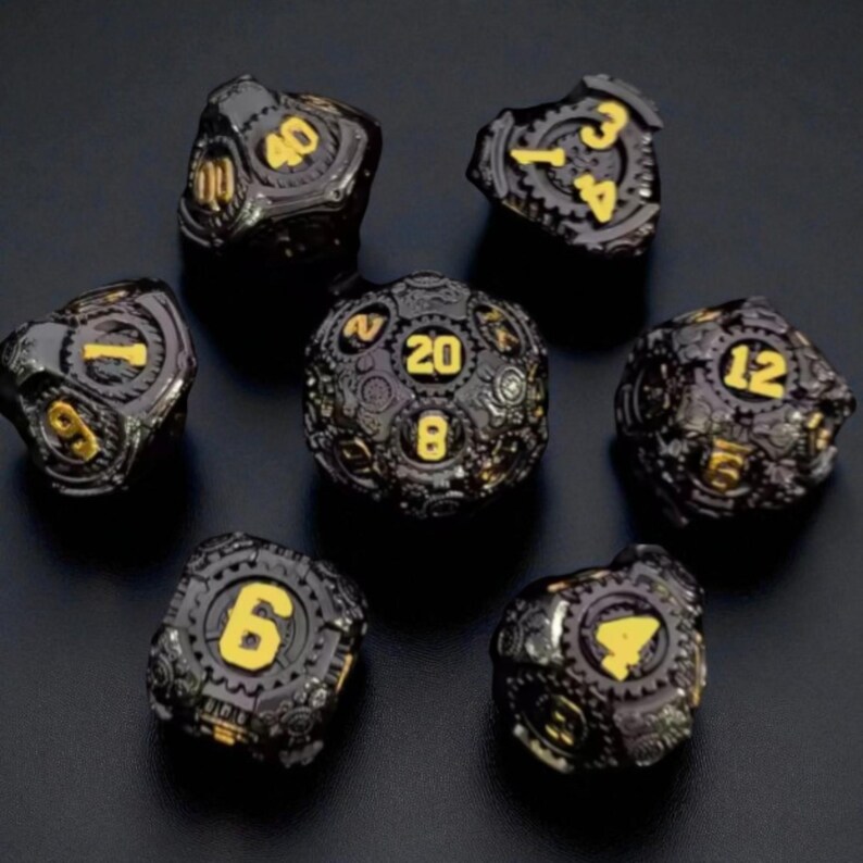May include: Set of seven black and gold dice with a steampunk design. Each die features gold numbers and intricate gear-like detailing. The dice are arranged on a dark surface, showcasing their unique aesthetic.