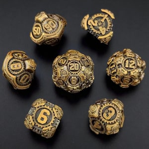 May include: A collection of seven bronze-colored, steampunk-style dice. Each die features intricate gear and cog designs with numbers. The dice are in various shapes, including a D20, D12, and D6, and are set against a dark background.