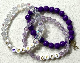 Conjunto de pulseras de cuentas moradas y de cristal