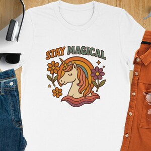 Stay Magical Unicorn T-Shirt, Retro Rainbow Tee, Floral Graphic Shirt, Positive Vibes Shirt, Trendy Women&#39;s Apparel, Gift for Unicorn Lovers