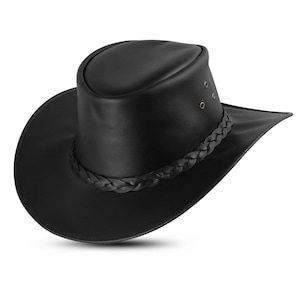 May include: A black leather hat with a wide brim and a braided band around the crown. The hat has a rounded crown and three small rivets on the side. This hat is a classic style, suitable for outdoor activities.