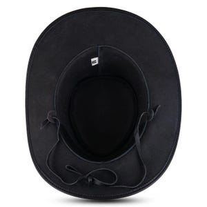 May include: Black cowboy hat with a wide brim and a leather chin strap. The hat has a round crown and a soft, textured appearance. The interior features a tag with a size marking.
