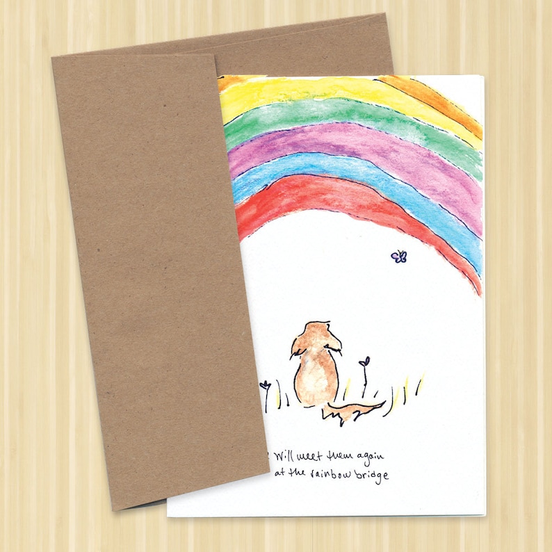 May include: A watercolor illustration of a rainbow with a small dog sitting in a field looking up at the rainbow. The text "We will meet them again at the rainbow bridge" is written below the dog.