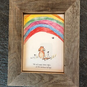May include: A framed watercolor painting of a dog standing under a rainbow with the text "We will meet them again at the rainbow bridge".