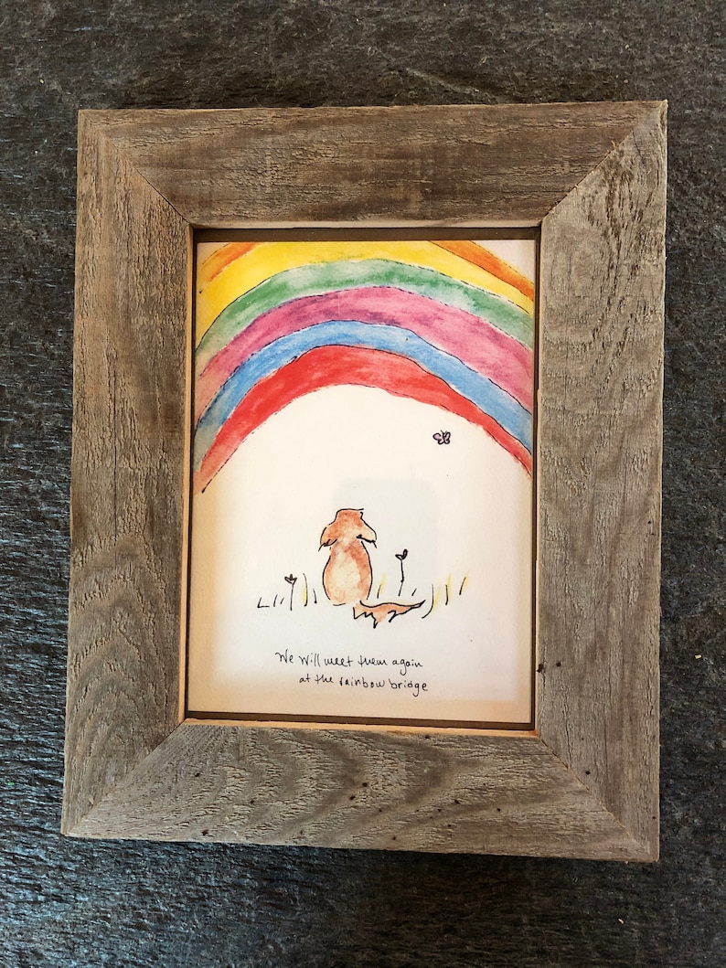 May include: A framed watercolor painting of a dog standing under a rainbow with the text "We will meet them again at the rainbow bridge".