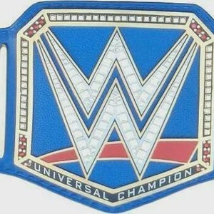 May include: A blue wrestling championship belt with a large silver and red logo in the center. The belt has gold accents and the words "UNIVERSAL CHAMPION" are visible. The belt has multiple holes for adjustment.