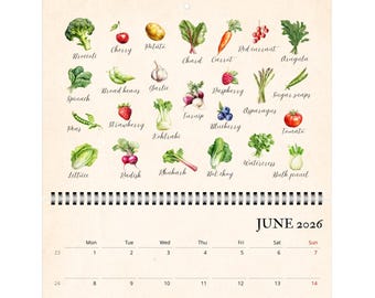 May include: A wall calendar for June 2026 featuring a top section with watercolor illustrations of various fruits and vegetables, each labeled with its name in cursive script. The bottom section displays a standard monthly grid layout.