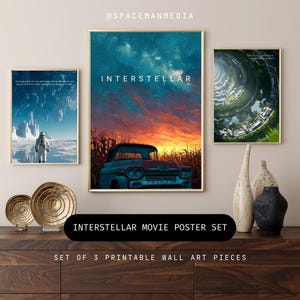 May include: Set of three framed "Interstellar" movie posters. The central poster features a vintage blue car against a sunset sky. Other posters depict an astronaut on a frozen planet and a futuristic city. Gold frames and decorative vases complete the display.