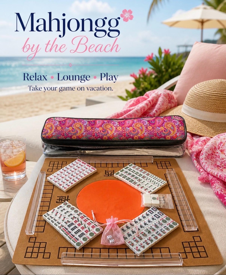 May include: A Mahjongg game set on a beach setting. The set includes tiles, a game board, and a carrying case with a paisley design. The text on the image says "Mahjongg by the Beach" and "Relax, Lounge, Play, Take your game on vacation."