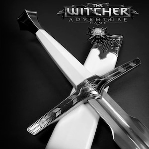 May include: A black and white image of a sword with a white handle and a silver blade. The sword is crossed with a white scabbard. The text "THE WITCHER ADVENTURE GAME" is at the top.