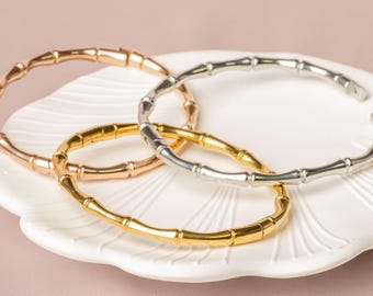 Brazalete con diseño en T: brazalete con eslabones en T de acero inoxidable, oro de 18 quilates, plata y oro rosa.