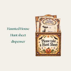 May include: A square cardboard dispenser box featuring a pumpkin, bats, and the text Please take a Hunt Sheet. Inside the box are multiple paper sheets titled Haunted House Hunt, which include illustrations of a bat and a black cat with checkboxes.