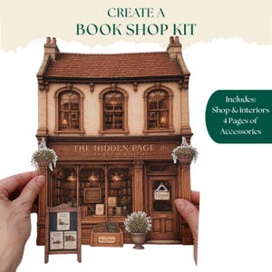 Op de afbeelding: Een papieren knutselset met een boekwinkel van twee verdiepingen genaamd The Hidden Page met bruine houttinten, een rood dak en boekenplanken. De set bevat een bord, een krat met de tekst Bargain Books en bijbehorende tekst.