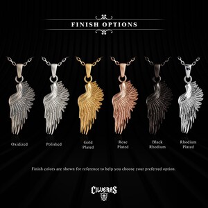 six different colored pendants of the same design, featuring wing-like elements, arranged in a row against a black background.