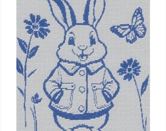 May include: A white fabric square featuring a blue woven design of a rabbit wearing a collared jacket. The rabbit is centered between two flowers and a butterfly. The pattern is created with a grid-like texture throughout the entire surface.